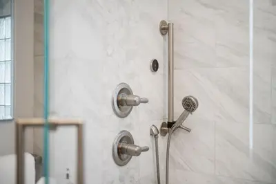 a shower with a shower head in a bathroom at DU Cherry Creek Bungalow Sleeps 4 in Denver