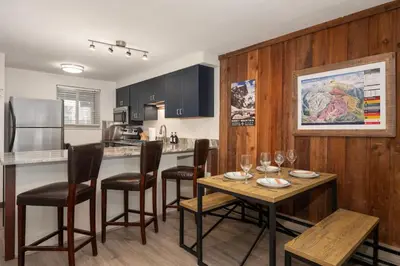 a kitchen with a table and chairs and a counter at Winter Park Chalet I Mtn Biking I Summer festivals in Winter Park