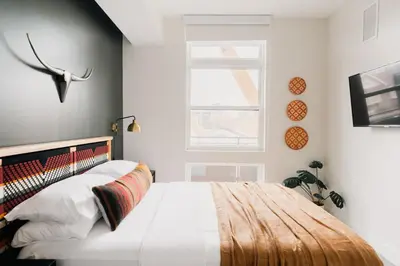 a bedroom with a bed and a window at 2880 Rhythm of the Night Loft at Espadin in Denver