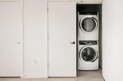 a laundry room with a washer and dryer at 2880 Rhythm of the Night Loft at Espadin in Denver