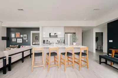 a kitchen with a table and chairs in a room at 2880 Rhythm of the Night Loft at Espadin in Denver