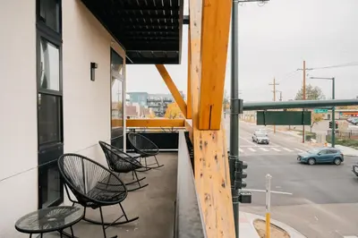 a group of chairs sitting on the balcony of a building at 2880 Rhythm of the Night Loft at Espadin in Denver