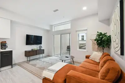 a living room with a couch and a tv at 2880 Natural Influence Sanctuary at Espadin in Denver