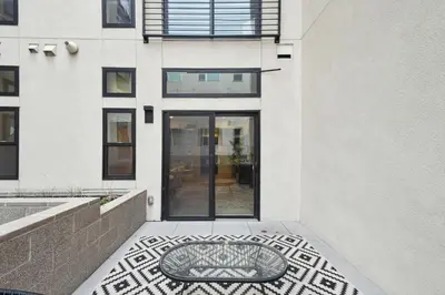 a dog bed sits on a sidewalk in front of a building at 2880 Natural Influence Sanctuary at Espadin in Denver