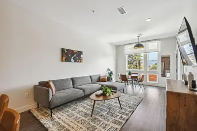 a living room with a couch and a table at 2880 Sophistication Simplified at Espadin in Denver