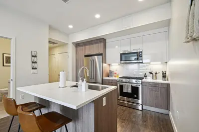 a kitchen with a sink and a stove top oven at 2880 Sophistication Simplified at Espadin in Denver
