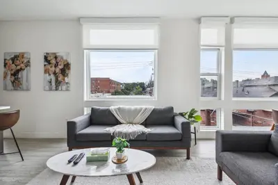 a living room with a couch and a table at 2880 Highline Hideaway at Espadin in Denver