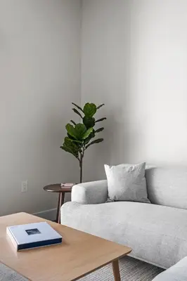 a living room with a couch and a table at 2880 Sky-High LoHi Oasis at Espadin in Denver