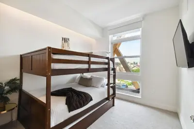 a bedroom with a bunk bed and a window at 2880 Rose All Day at Espadin in Denver