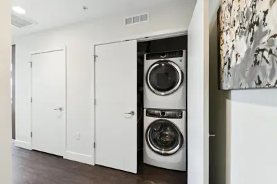 a laundry room with two washer and dryer at 2880 Rose All Day at Espadin in Denver