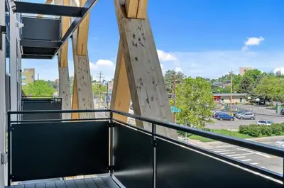 a balcony with a view of a parking lot at 2880 Canvas & Comfort at Espadin in Denver