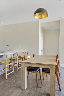 a dining room with a wooden table and chairs at 2880 Canvas & Comfort at Espadin in Denver
