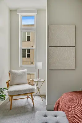 a bedroom with a chair and a window at 2880 Sky Edge Suite at Espadin in Denver
