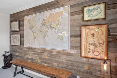 a wall with a map and a wooden bench at City Center Oasis Prime Location with Views in Denver