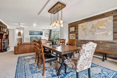 a dining room with a wooden table and chairs at City Center Oasis Prime Location with Views in Denver