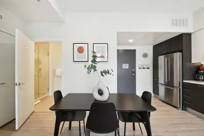 a dining room with a black table and black chairs at 2880 Enchanting Moroccan Oasis in Denver