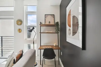a living room with a table and a chair at 2880 Enchanting Moroccan Oasis in Denver