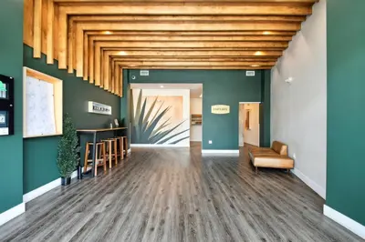 a hallway with green walls and a wooden ceiling at 2880 Enchanting Moroccan Oasis in Denver