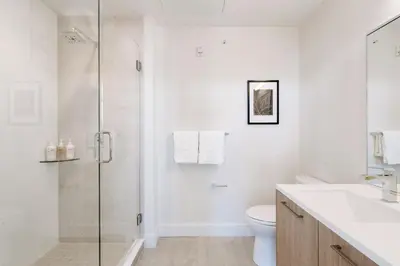 a bathroom with a shower and a toilet and a sink at 2880 Denver Skyline Escape at Espadin in Denver