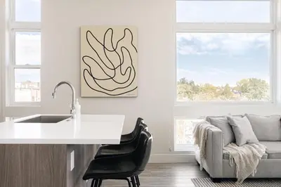 a kitchen with a sink and a couch at 2880 Denver Skyline Escape at Espadin in Denver