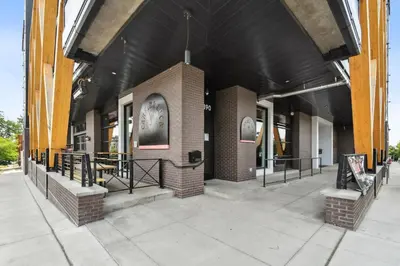 a brick building with a black roof at 2880 Denver Skyline Escape at Espadin in Denver
