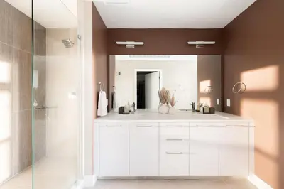 a bathroom with a white sink and a mirror at 2880 Bold & Elevated in Denver
