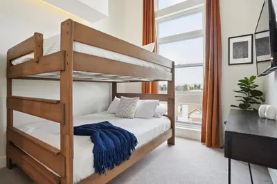 a bedroom with a bunk bed and a desk at 2880 Skyline Penthouse at Espadin in Denver