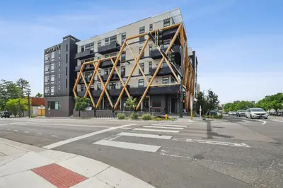 a large building on the corner of a street at 2880 Skyline Penthouse at Espadin in Denver