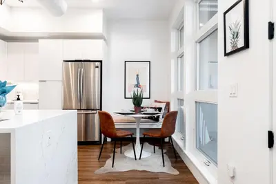 a kitchen and dining room with a table and chairs at 3198 Bohemian Hideaway at RiNo Art Lofts in Denver