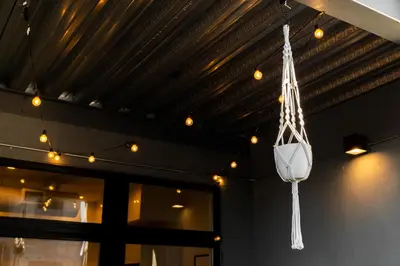 a pot hanging from the ceiling of a building at 3198 Bohemian Hideaway at RiNo Art Lofts in Denver