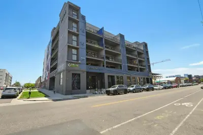 a large building on the corner of a street at 3198 Urban Cowboy Escape at RiNo Art Lofts in Denver