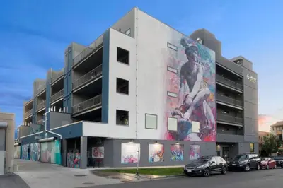 a building with a mural on the side of it at 3198 Graffiti & Skyline at RiNo Art Lofts in Denver