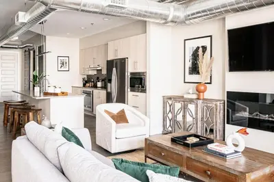 a living room with a couch and a table at 3198 Bright & Breezy at RiNo Art Lofts in Denver