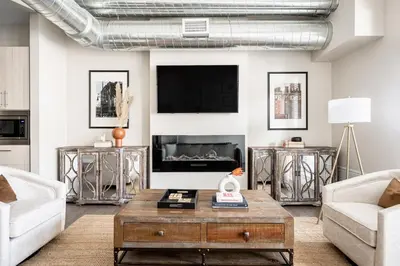 a living room with a couch and a coffee table at 3198 Bright & Breezy at RiNo Art Lofts in Denver