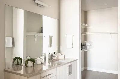 a bathroom with two sinks and a mirror at 3198 Bright & Breezy at RiNo Art Lofts in Denver