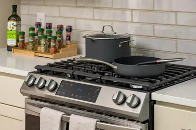 a pot on top of a stove in a kitchen at Accomodate 24 Guests with 2 Rooftops and 2 Hot Tubs and 2 Game Rooms in Denver