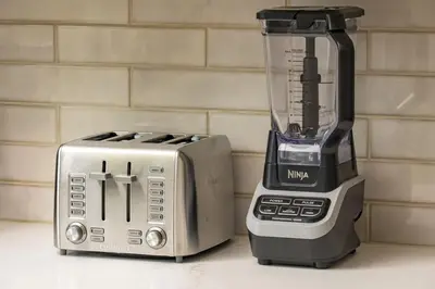 a blender and a toaster sitting on a counter at Hot Tub With Rooftop A Game Room And5 Bathrooms in Denver