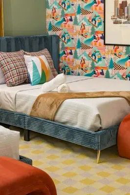 a bedroom with a bed and a colorful wallpaper at Hot Tub With Rooftop A Game Room And5 Bathrooms in Denver