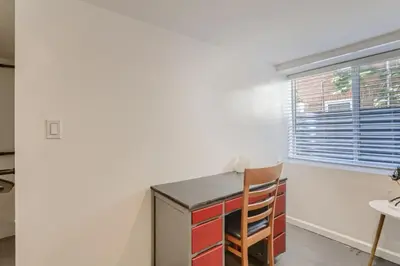 a room with a desk and a chair and a window at A Pet Friendly And Remodeled I Near RiNo Where Sleeps 7 in Denver