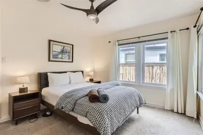 a bedroom with a bed and a window at Cozy Duplex near Hospitals and Cherry Creek in Denver in Denver