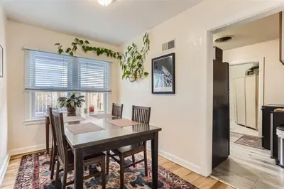 a dining room with a table and chairs at Cozy Duplex near Hospitals and Cherry Creek in Denver in Denver