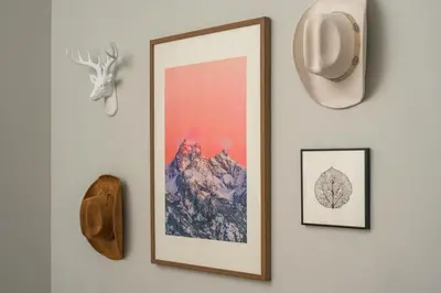 a picture hanging on a wall with a picture of a tree at Luxe 4BR Mtn Retreat With Stunning Views Near Ski AndHikes in Nederland