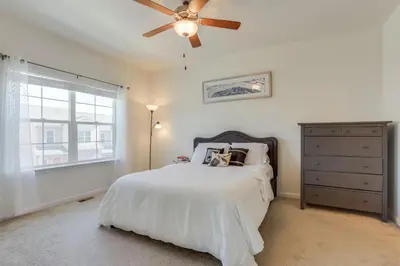 a bedroom with a bed and a ceiling fan at Beautiful New Townhome in Denver