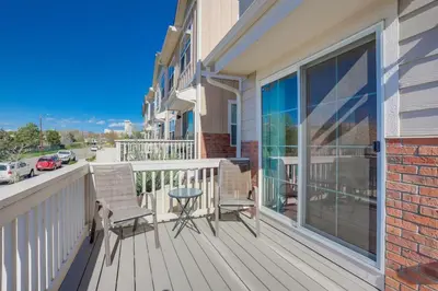 a balcony with two chairs and a table at Beautiful New Townhome in Denver