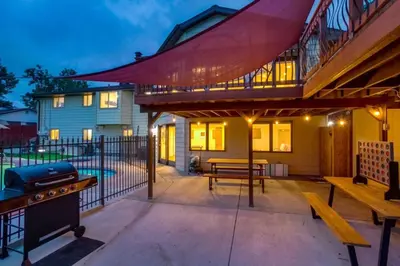 a patio with a grill and a picnic table at Backyard Oasis Pool Is A Beautiful Home in Arvada