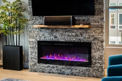 a fireplace with a tv on top of it at Modern And Spacious Townhouse Blocks from Downtown in Denver