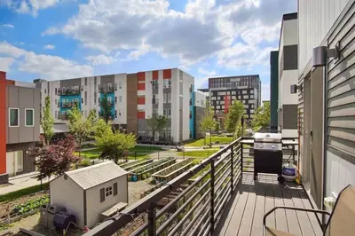 a balcony with a view of a city with buildings at Modern And Spacious Townhouse Blocks from Downtown in Denver