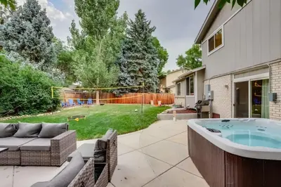 a backyard with a jacuzzi tub in a yard at A Great Location Modern Home With A Hot Tub in Arvada