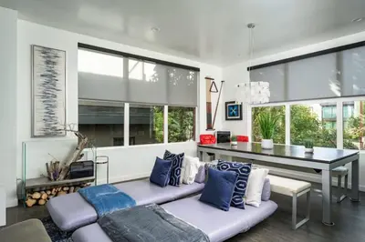 a living room with a couch and a table at Skyline House An Eco Efficient Luxury Home in Denver