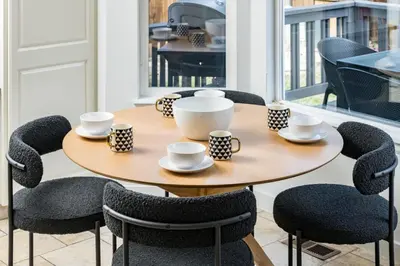 a table and chairs with cups and saucers on it at Artist Getaway In Downtown Westminster in Westminster